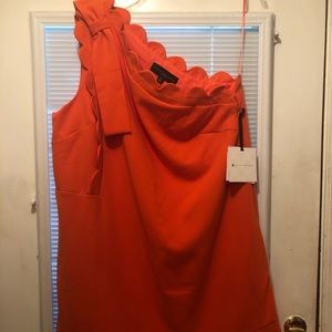 A one shoulder dress.